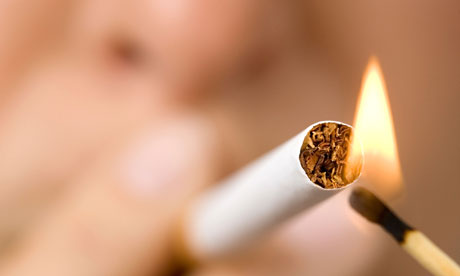 Young woman smoking cigarette