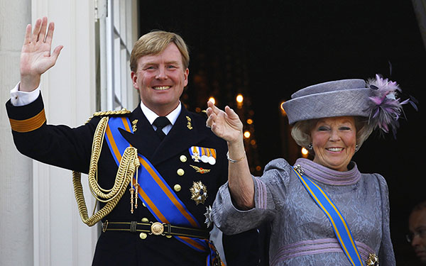 File photo showing Netherlands' Beatrix and her son Crown Prince Willem-Alexander waving to well-wishers from the balcony of the Royal Noordeinde Palace after opening the new parliamentary year in The Hague